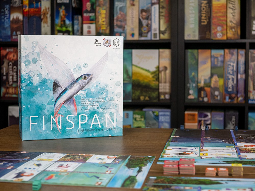 Caja del juego de mesa Finspan inspirado en WingSpan con tablero desplegado