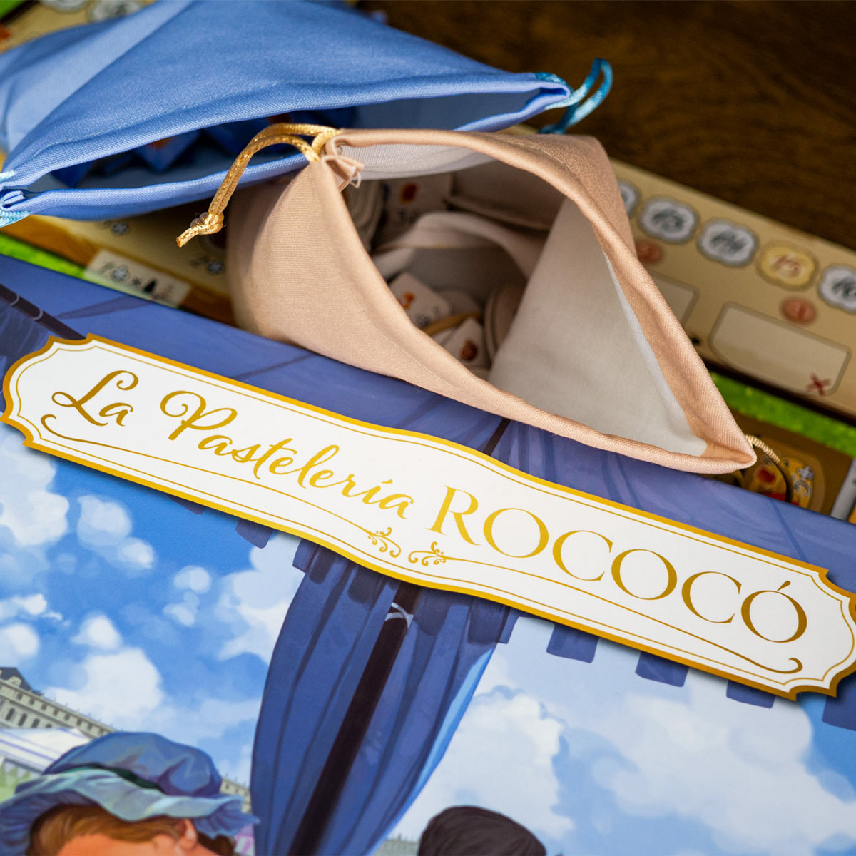 Juego de mesa La Pastelería Rococó con componentes y bolsas de tela