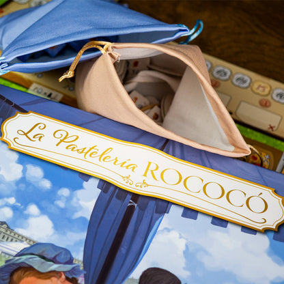 Juego de mesa La Pastelería Rococó con componentes y bolsas de tela
