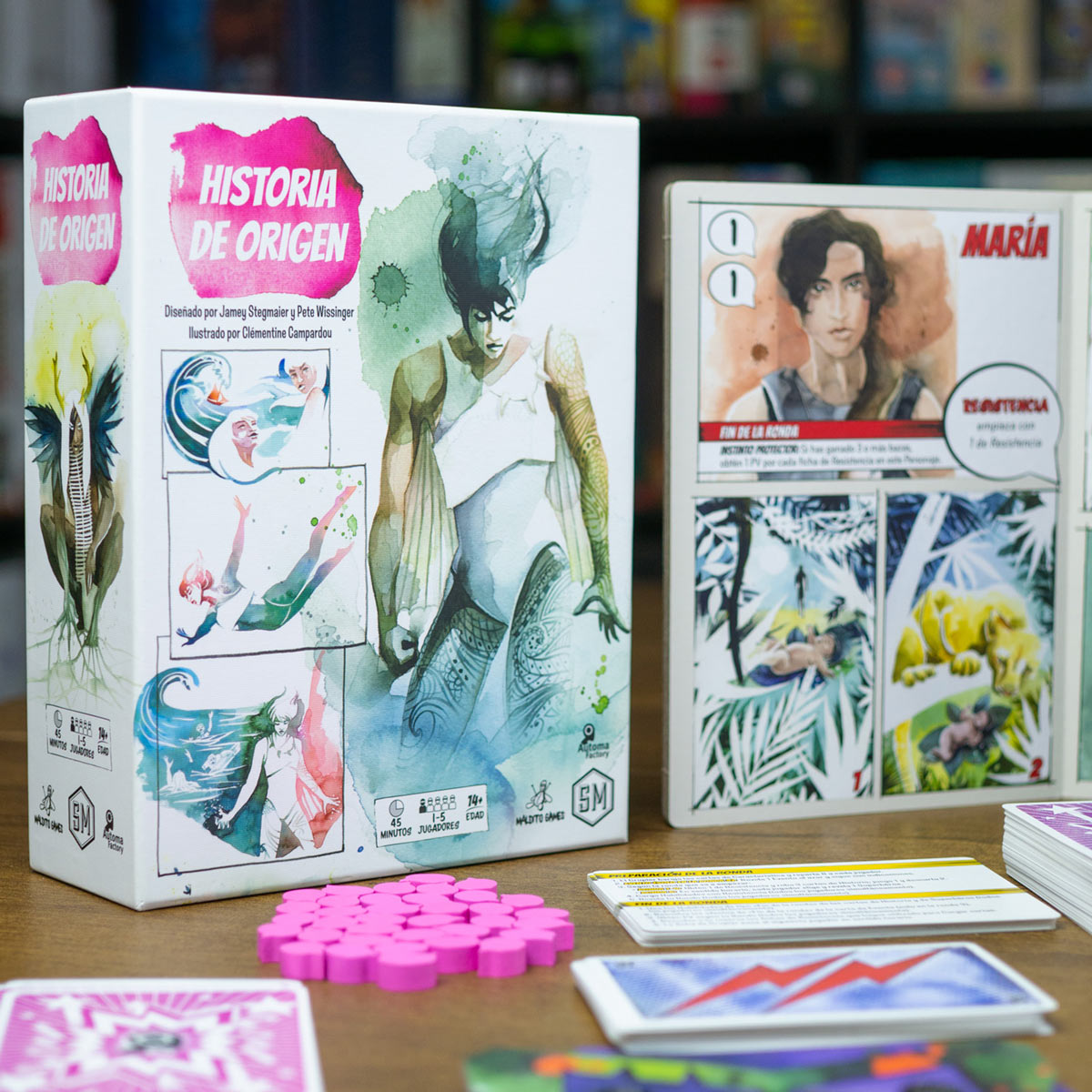 Caja del juego de mesa Historia de Origen con arte en acuarela y cartas de cómic