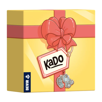 Caja regalo del juego de cartas Kado en amarillo con lazo rosa y logotipo de Devir