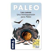 Caja de la expansión Las Cuevas para el juego de mesa Paleo, ilustración de entrada de cueva oscura