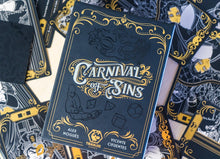 Caja del juego de estrategia Carnival of Sins con arte dorado y negro