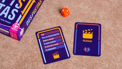 Juego de mesa Despistas mostrando cartas de ejemplo y dados