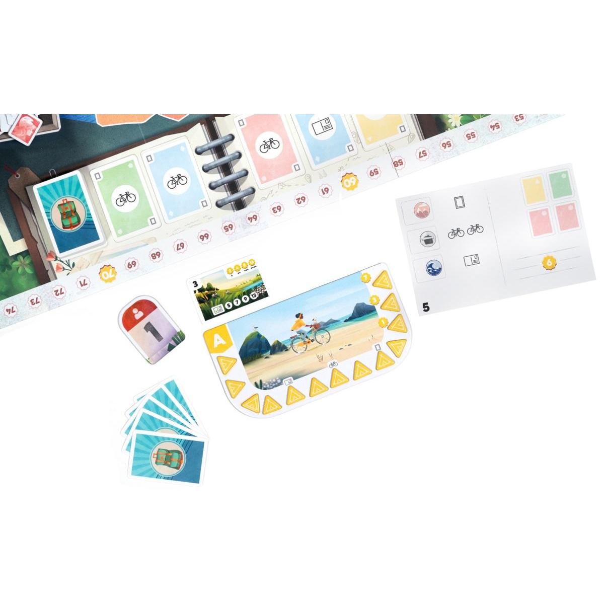 Componentes del juego de mesa Postales incluyendo tablero cuaderno, tarjetas de ruta y marcadores de puntuación