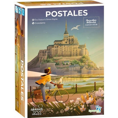 Caja del juego de mesa Postales con expansión Maravillas Naturales, ilustración de ciclista y Mont Saint-Michel