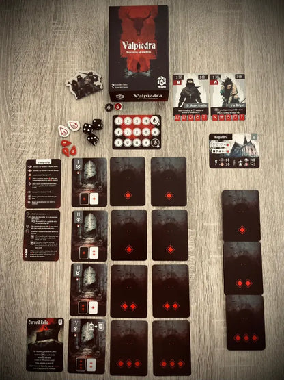 Contenido completo del juego de mesa Valpiedra: caja, tablero de cuevas, enemigos y componentes