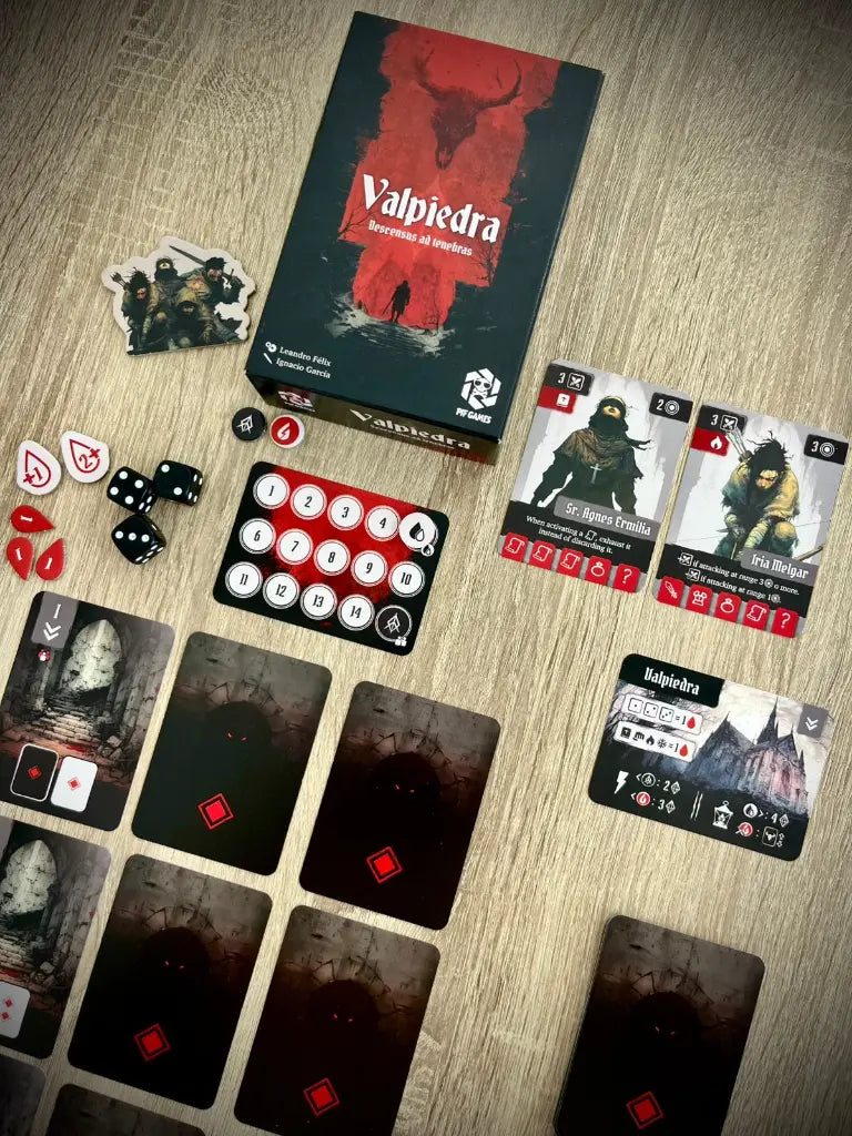 Distribución completa del juego de mesa Valpiedra: fichas, dados, cartas y caja central