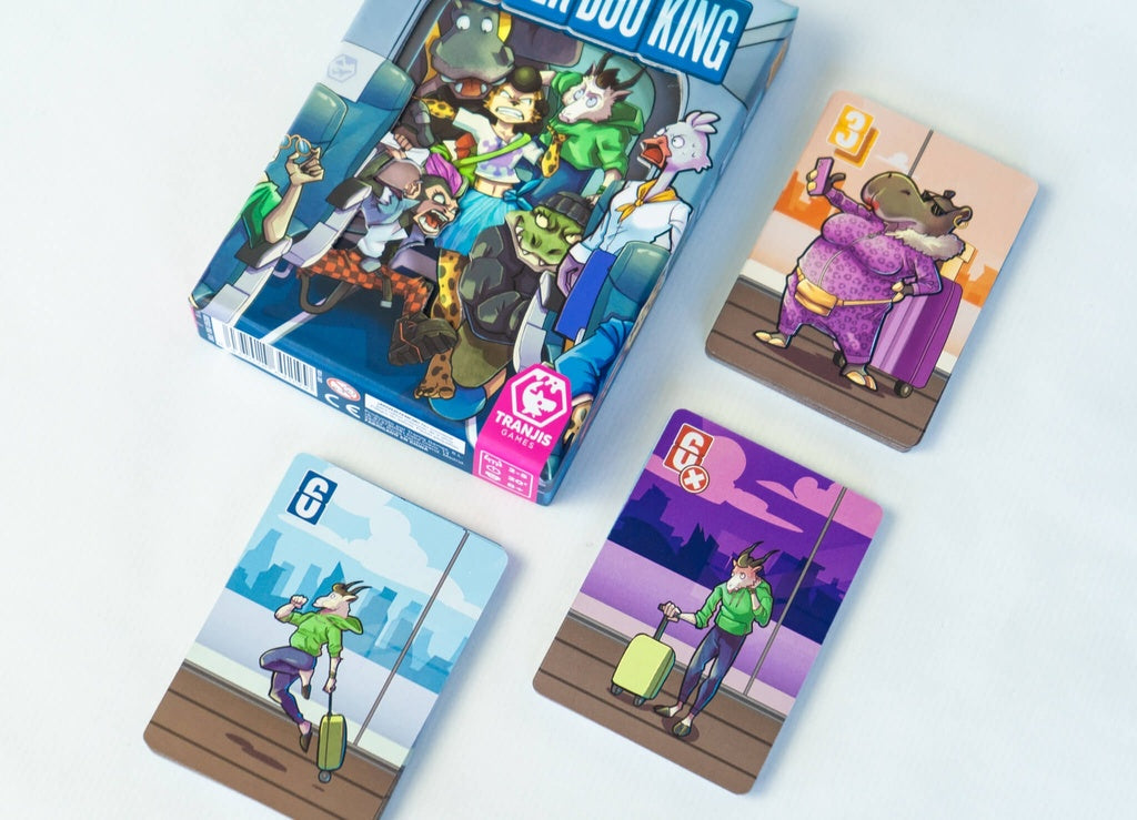 Caja del juego de mesa Zooverbooking con animales en avión y cartas de hipopótamo morado