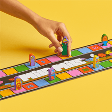 Tablero del juego de carreras Magical Athlete con fichas y casillas de colores