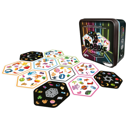 Juego de cartas Dobble Connect Power Out sobre mesa blanca con caja metálica y cartas dispersas