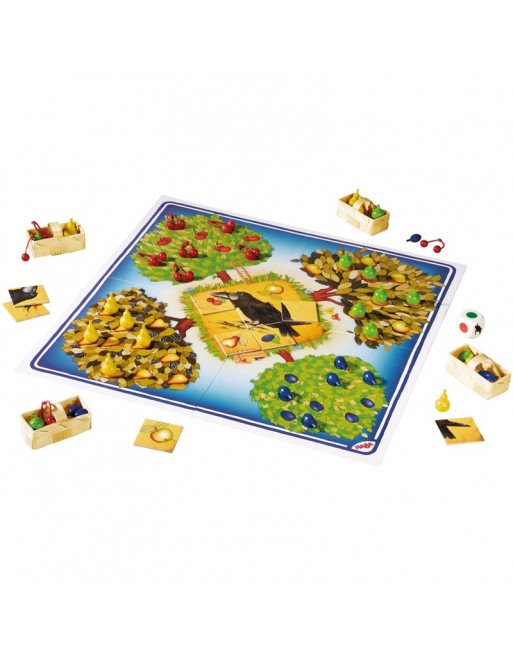 Tablero desplegado juego cooperativo El Frutal HABA con árboles frutales, cuervo y componentes