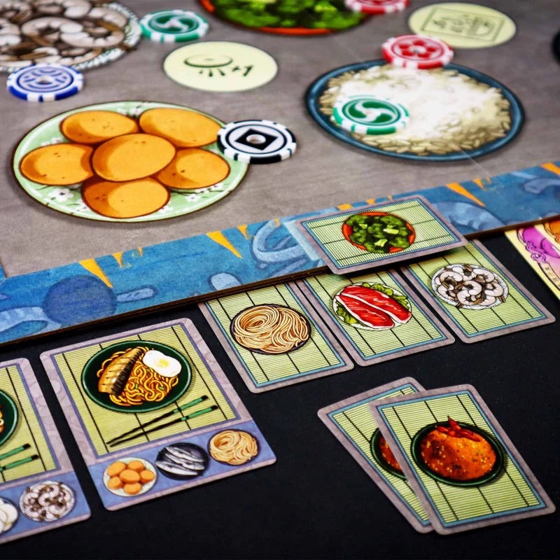 Tablero de juego Hibachi: ¡A fuego! con cartas de recetas y fichas