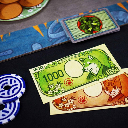 Billetes yen y fichas de póquer del juego de mesa Hibachi: ¡A fuego!