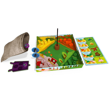 Componentes del juego cooperativo El Espantapájaros Feliz incluyendo bolsa de tela y fichas de madera