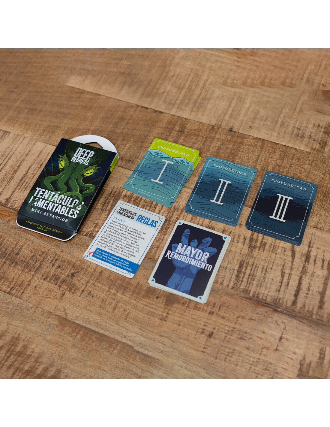 Contenido expansión Tentáculos Lamentables con cartas, reglas y componentes del juego